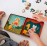 Petit Collage Magnetic Play Set, Animal Band - Mix & Match Magnetic Game Board, Ideal for Ages 3+ - Includes 2 Magnetic Scenes and over 25 Magnet Pieces, Ideal Travel Activity for Kids