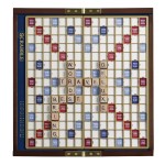 WS Game Company Scrabble Deluxe Travel Edition - Compact Travel Game with Wood Letter Tiles, Raised Grid, Folding Board, and Hidden Storage - Great for 2 to 4 Players