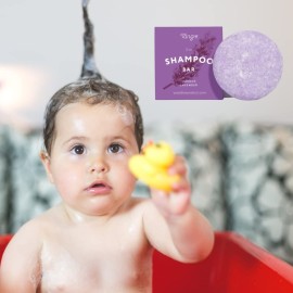 Natural Lavender Solid Shampoo Bar by Tangie. Lasts 50+ washes. Made in Florida, USA. Paper packaging is recyclable and compostable.